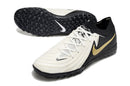Chaussure de foot Nike Phantom GX 2 Elite TF noire, blanche et dorée "Mad Ready Pack"