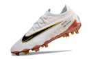 Chaussure de foot Nike Phantom GX Elite FG blanche et dorée "United Golden Pack"